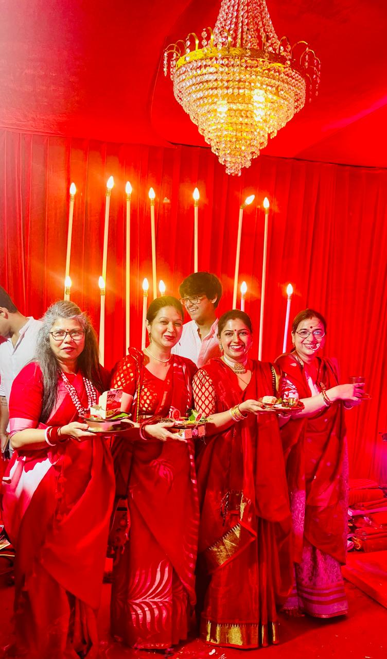 Women celebrating before Maa Durga at Pujo 2025